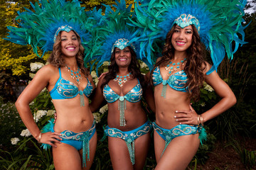 Women smiling and posing caribana carnival costume blue feathers 4