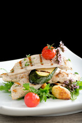 Grilled chicken fillet with fresh vegetables and potato