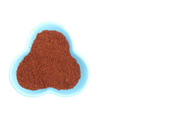 Ground coffee in cup and copy space for text