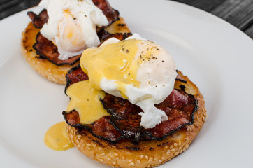 Benedict eggs with crispy bacon and hollandaise sauce