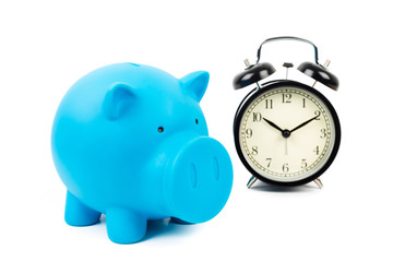 Alarm clock and piggy bank concept for saving time