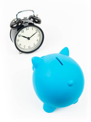 Alarm clock and piggy bank concept for saving time