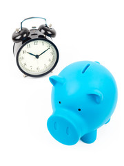 Piggy bank and alarm clock concept for saving time