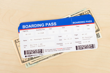 Boarding pass and dollar banknote concept for travel expenses