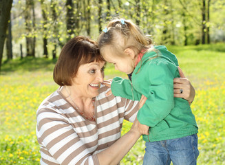 Fototapeta premium Grandmother has fun with granddaughter 