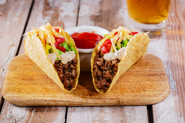 tacos with minced meat with greens and tomatoes
