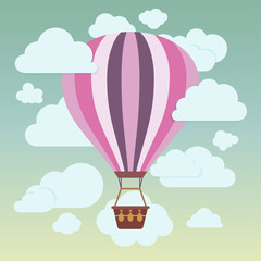 Fototapeta premium Clouds and striped hot air balloon on a blue background