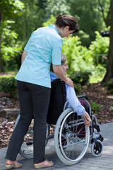 The nurse went out for a walk with an older woman