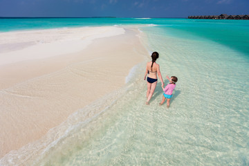 Mother and daughter at tropical beach