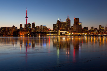 Fototapeta na wymiar Toronto Skyline Frozen Lake Winter Cold Reflection