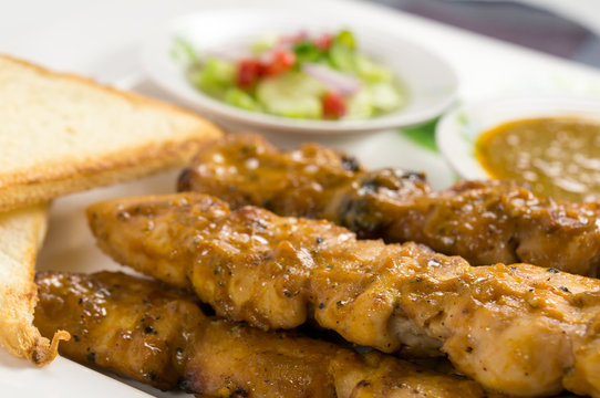 Chicken satay with bread