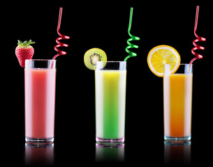 tasty summer fruits with juice in glass