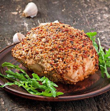 Baked pork decorated with arugula leaves