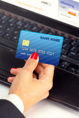 Businesswoman holding credit card - e banking / shopping