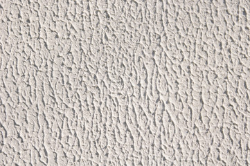 White rough plaster on wall closeup