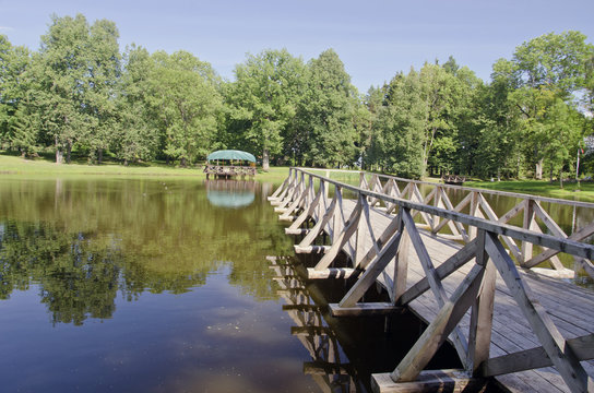 wooden bridge on pond water