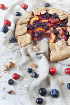 french galette with apricots peaches blueberries and rose hip