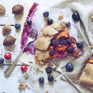 polaroid of wholemeal french galette with fruits sliced