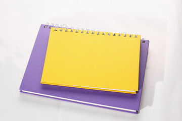 Stationeryl notebooks on white background