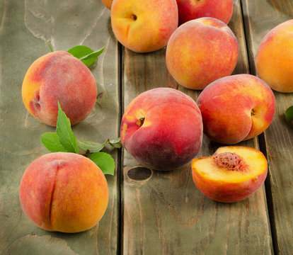 fresh peaches on a wooden table
