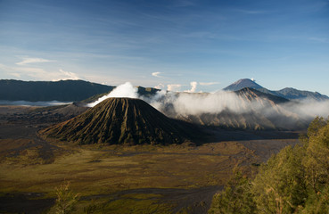 Fototapeta na wymiar Active volcano crater with smoke, Bromo, Indonesia