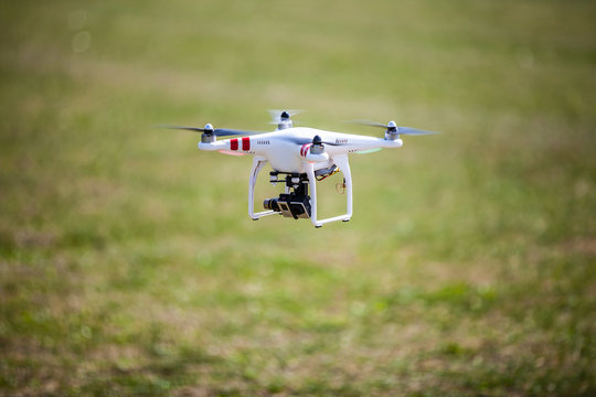 Flying drone in field 