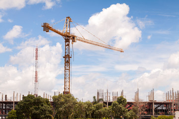 Construction site with cranes on sky background.