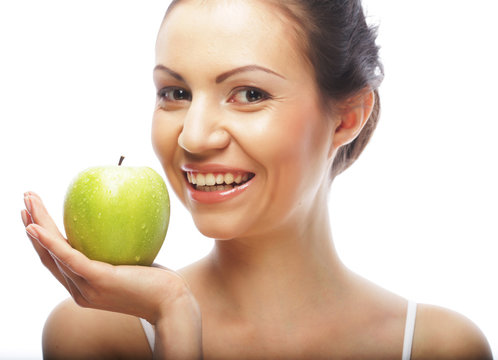 smiling woman with green apple