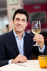 Man drinking wine at the restaurant