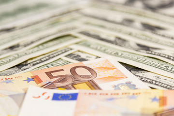 Obraz na płótnie Canvas Euro and dollars bills