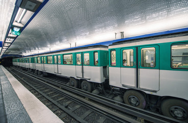 Fototapeta premium Metro train in Paris. Underground parisian scene - France