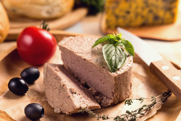 Duck pate on plate with basil