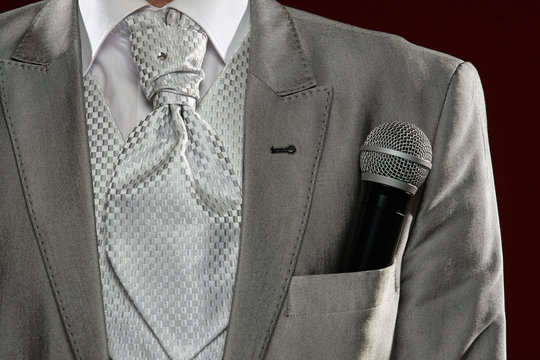 Man standing with microphone in pocket