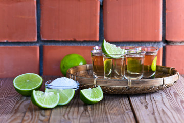 gold tequila with salt and lime