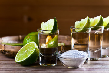 gold tequila with salt and lime