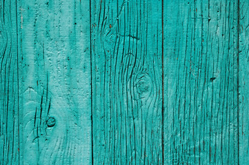Fototapeta na wymiar Old green wooden fence closeup