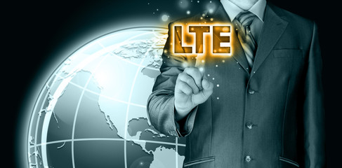 businessman is pushing his finger on lte button