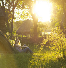 beautiful blonde enjoys the sun on a walk / country style