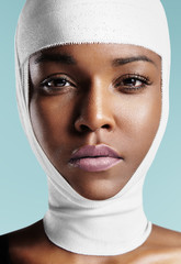 black woman with bandaged head