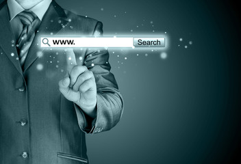 Businessman pushing virtual search bar