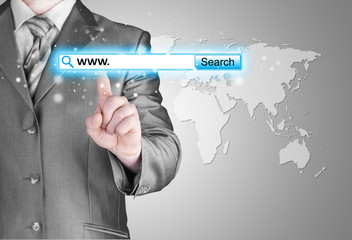 Businessman pushing virtual search bar