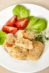 roasted fish fillet covered with sesame seeds