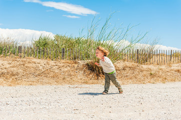Cute toddler boy having fun outdoors