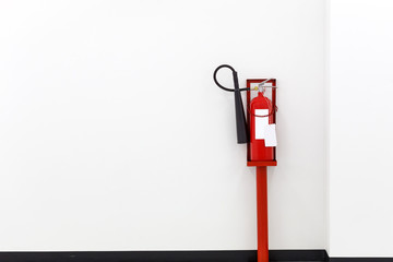 Fire extinguisher equipment on the white wall