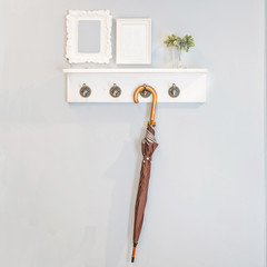 Umbrellas hanging against the wall with picture flames