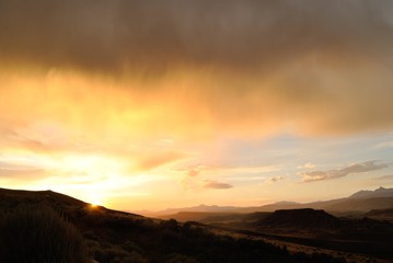 landscape of mountains and fields at sunset, wyoming,usa