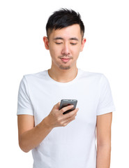 Young man check message on mobile phone