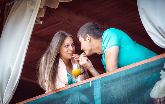 young couple in an open-air cafe