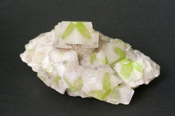 Green dioptase in calcite from Namibia. 10cm across.
