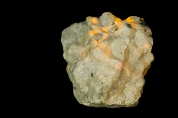 Fluorescent Hackmanite under ultraviolet light. 7cm high